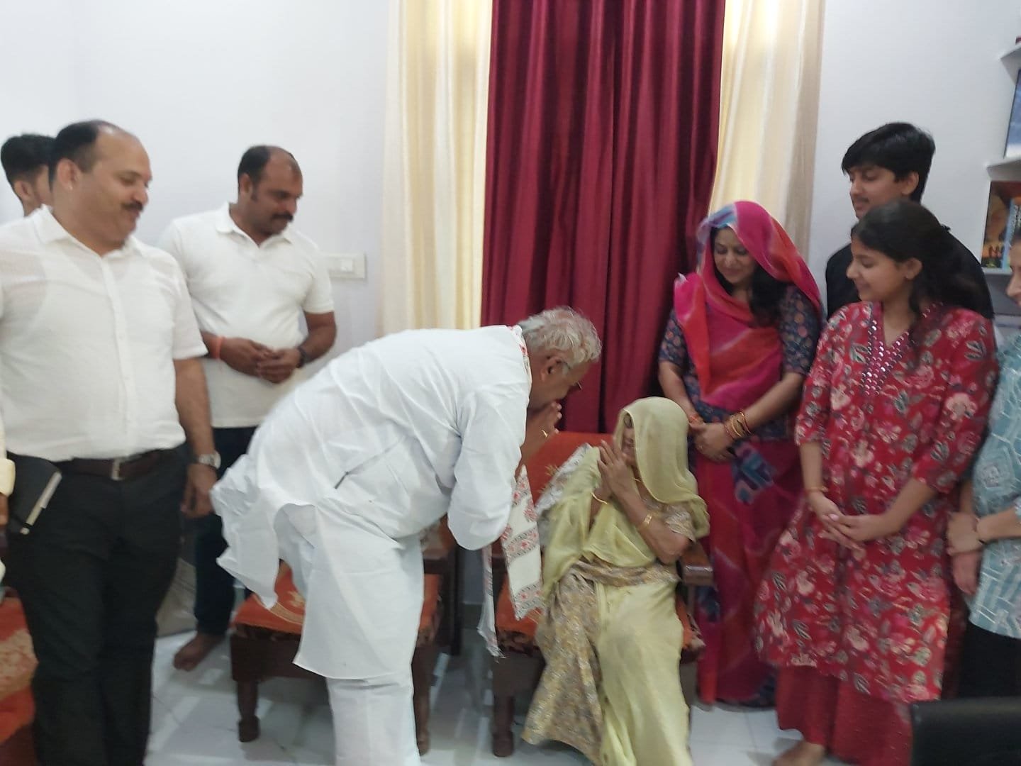 Education Minister Visits Officer’s Residence, Seeks Blessings from His Mother