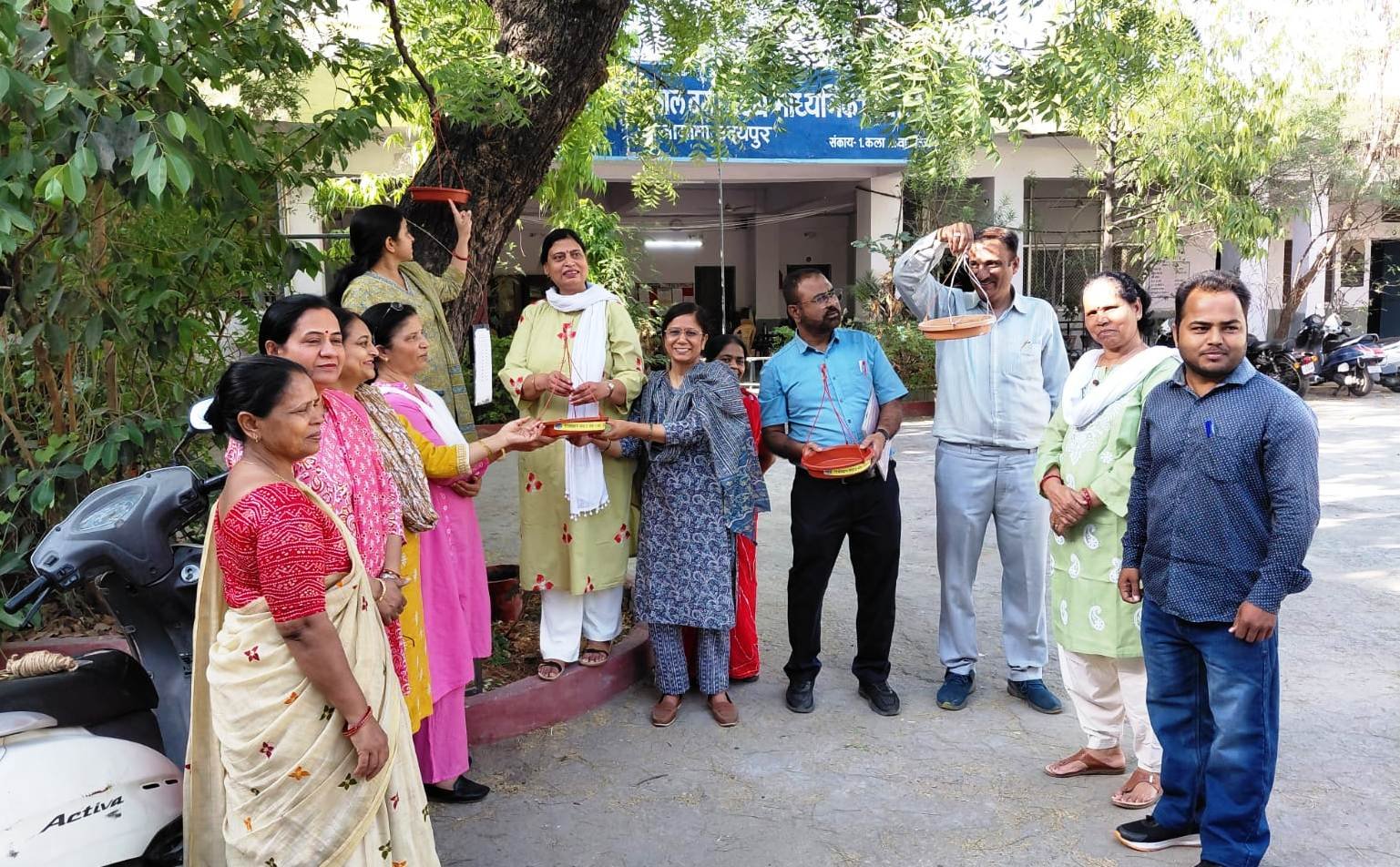 Students and Teachers Install Bird Water Pots