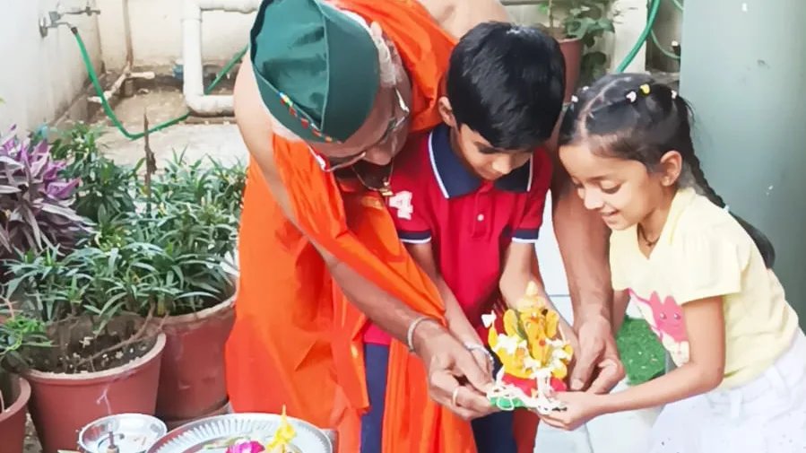 Clay Ganesha Immersed in a Bucket, Leaves Behind a Green Message